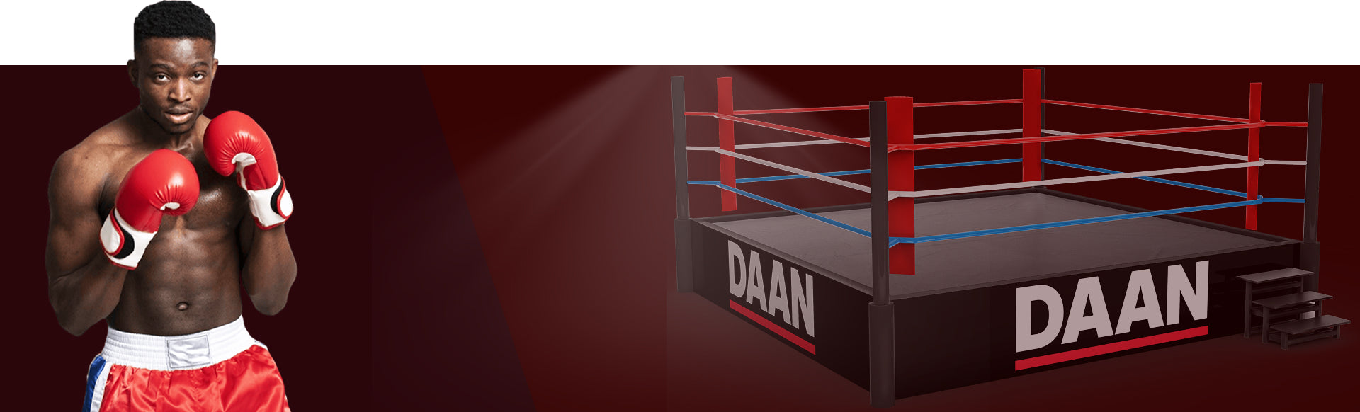Boxer in red gloves and shorts standing next to a boxing ring with 'DAAN' branding.